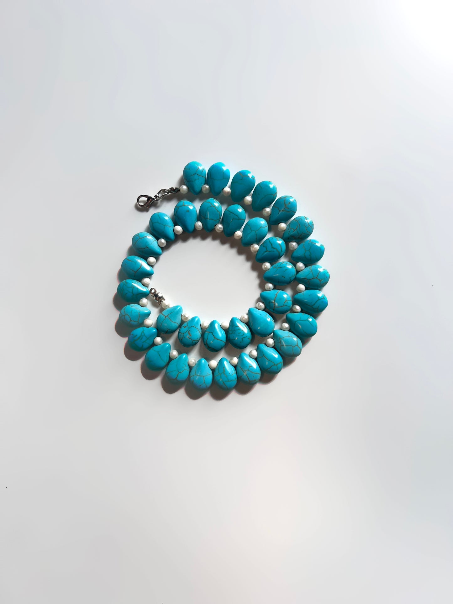Rimzim: A Luminous Fusion of Magnesite Turquoise and Pearls